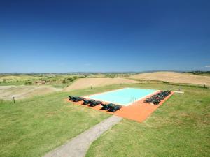 an overhead view of a swimming pool in a field at Holiday Home Capanna by Interhome in Casetta