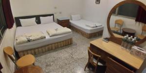 Postel nebo postele na pokoji v ubytování Sun Wu Homestay
