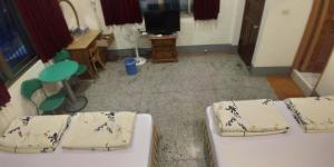 Llit o llits en una habitació de Sun Wu Homestay