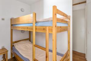 Postel nebo postele na pokoji v ubytování Residences Quartier Falaise - maeva Home
