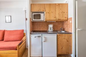 Kuchyň nebo kuchyňský kout v ubytování Residences Quartier Falaise - maeva Home