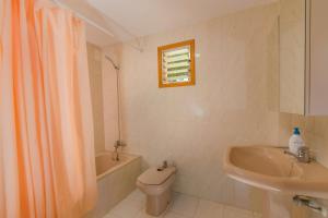 a bathroom with a toilet and a sink and a shower at C250 Villa Canta by Mallorca Villa Selection in Playa de Muro +19 photos