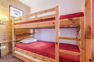 Postel nebo postele na pokoji v ubytování Residences Quartier Falaise - maeva Home