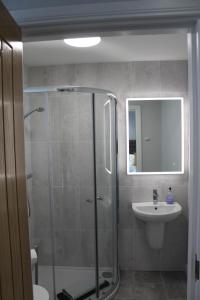 a bathroom with a shower and a sink at Apt 1, Frasers Close, Kirkwall in Kirkwall