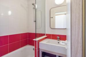 Koupelna v ubytování Residences Quartier Falaise - maeva Home + 37 fotografií