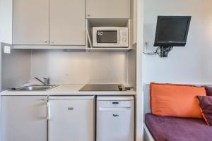 Kuchyň nebo kuchyňský kout v ubytování Residences Quartier Falaise - maeva Home