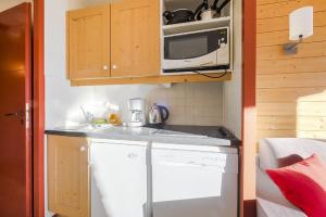 Kuchyň nebo kuchyňský kout v ubytování Residences Quartier Falaise - maeva Home
