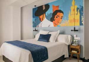 a bedroom with a bed with a large painting on the wall at Feria Pool & Luxury in Seville +113 photos