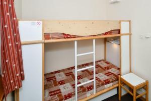 Postel nebo postele na pokoji v ubytování Residences Quartier Falaise - maeva Home