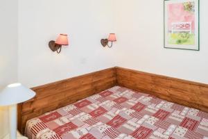 Postel nebo postele na pokoji v ubytování Residences Quartier Falaise - maeva Home