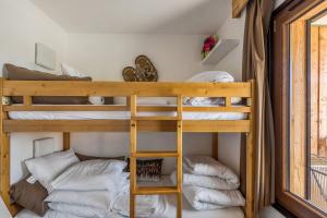 Postel nebo postele na pokoji v ubytování Residences Quartier Falaise - maeva Home