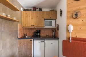 Kuchyň nebo kuchyňský kout v ubytování Residences Quartier Falaise - maeva Home