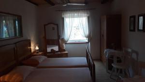 Postel nebo postele na pokoji v ubytování Apartments Lovor