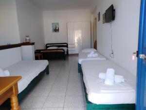 Postel nebo postele na pokoji v ubytování LIKNO'S Ios island Resort