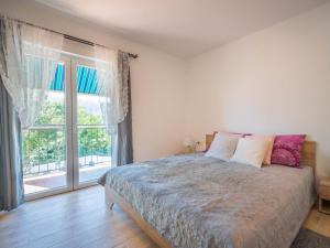 Postel nebo postele na pokoji v ubytování Holiday Home Ivona by Interhome