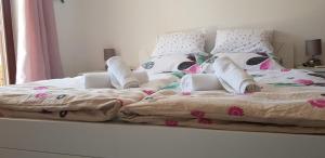 Postel nebo postele na pokoji v ubytování APARTMAN MASTER LUPI M&S