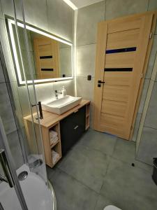 Kúpeľňa v ubytovaní Apartment Cyprys 1