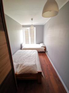 Posteľ alebo postele v izbe v ubytovaní Apartment Cyprys 1