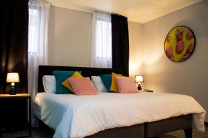 Postel nebo postele na pokoji v ubytování The PopCity Hotel