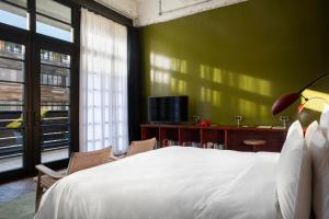 Postel nebo postele na pokoji v ubytování Stamba Hotel