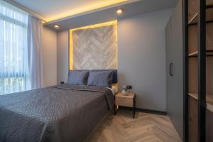Postel nebo postele na pokoji v ubytování Meyde Boutique Suites + 30 fotografií