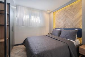 Postel nebo postele na pokoji v ubytování Meyde Boutique Suites