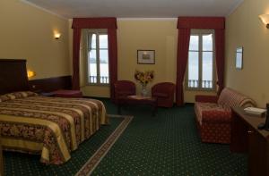 Postel nebo postele na pokoji v ubytování Europalace Hotel
