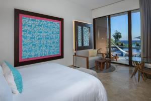 Postel nebo postele na pokoji v ubytování Hotel Xcaret Mexico All Parks All Fun Inclusive