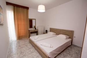 Voodi või voodid majutusasutuse KOS Family House toas