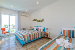 Säng eller sängar i ett rum på Villa Sorrento Flats