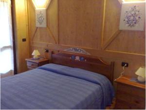 سرير أو أسرّة في غرفة في La Vecchia Latteria