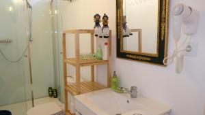 a bathroom with a shower and a toilet and a sink at PH in Atlantic Coast in Charneca +30 photos