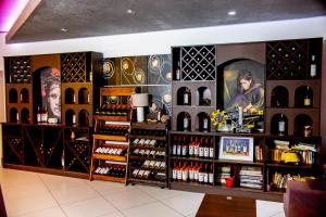 a wine store with a lot of wine bottles at Pension Daciana in Bacău