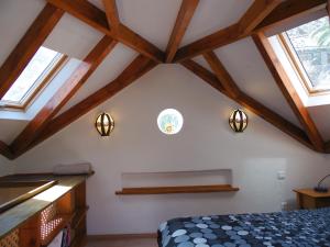 a bedroom with wooden ceilings and skylights at Casa Mia in Valle Gran Rey