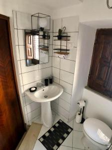 a bathroom with a sink and a toilet at “La Rampa” Affitti Brevi - Racalmuto (AG) Sicilia in Racalmuto