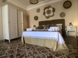 Postel nebo postele na pokoji v ubytování “La Rampa” Affitti Brevi - Racalmuto (AG) Sicilia