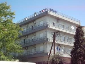 a building with people on the balconies of it at Oceanis in Thessaloniki