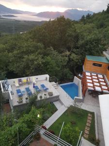an aerial view of a house with a swimming pool at Apartment Panorama in Kotor