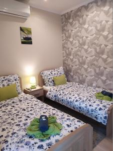 Posteľ alebo postele v izbe v ubytovaní Silver Apartman