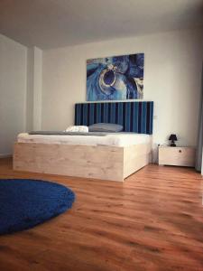 A bed or beds in a room at Moment Apartments