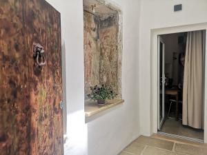 a door to a room with a painting on the wall at B & B San Giovanni 9 in Gallipoli