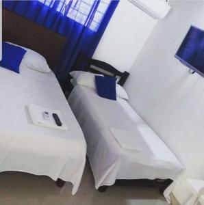 Postel nebo postele na pokoji v ubytování Altamira Hotel