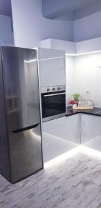 a kitchen with a stainless steel refrigerator at Anastasis garden room in Kalamata