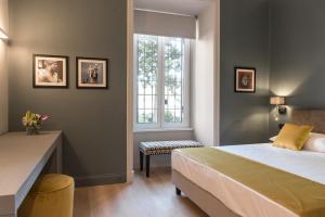 A bed or beds in a room at Domus Alberico