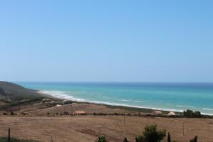 a view of a beach and the ocean at B&B L'EDEN DI CAPO BIANCO in Montallegro