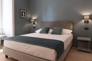 A bed or beds in a room at Domus Alberico