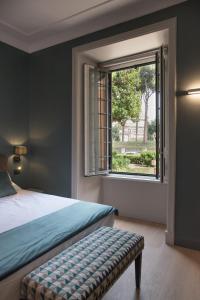 A bed or beds in a room at Domus Alberico