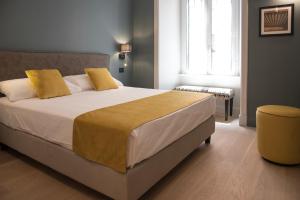 A bed or beds in a room at Domus Alberico