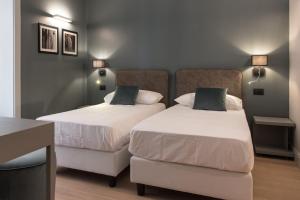A bed or beds in a room at Domus Alberico