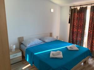 Ένα ή περισσότερα κρεβάτια σε δωμάτιο στο Apartment Jana